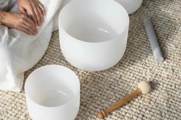 Immersive sound healing with crystal bowls and gongs for deep relaxation and stress relief.